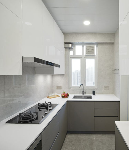 UrbanTrendz L-shape premium modular kitchen in white and grey with sleek acrylic finish, designed by Arancia Kuchen for modern homes.